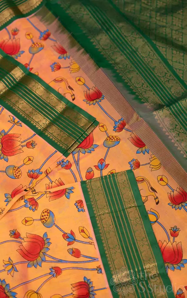 Light peach silk cotton saree with green rettaipet border