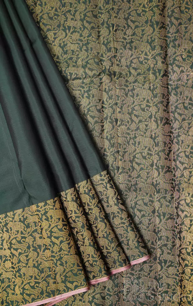 Green kanchipuram silk saree with vanasingharm border