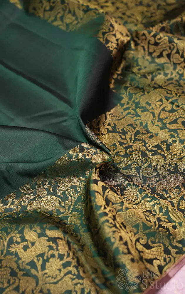 Green kanchipuram silk saree with vanasingharm border