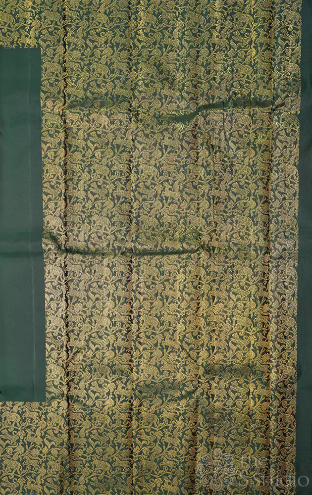 Green kanchipuram silk saree with vanasingharm border