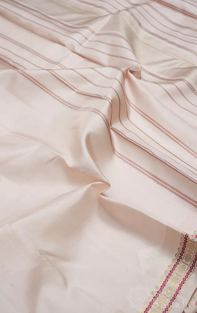 Off white plain kanchi silk saree with small zari border
