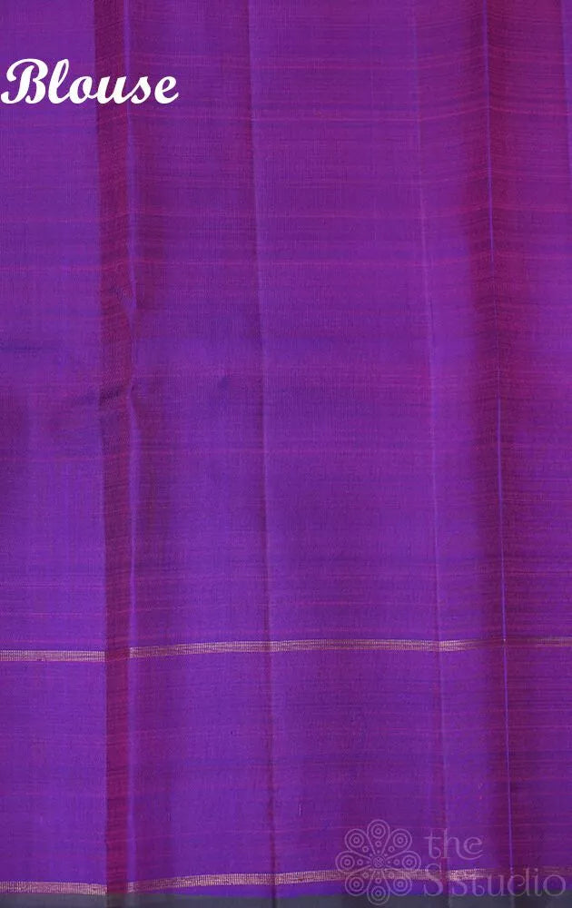 Purple kanjivaram silk saree with small buttas and rettai pet border
