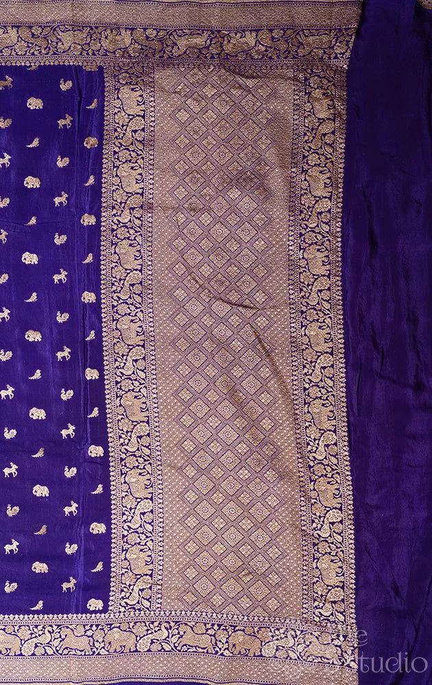 Violet crepe banarasi silk saree with antique zari buttas and border