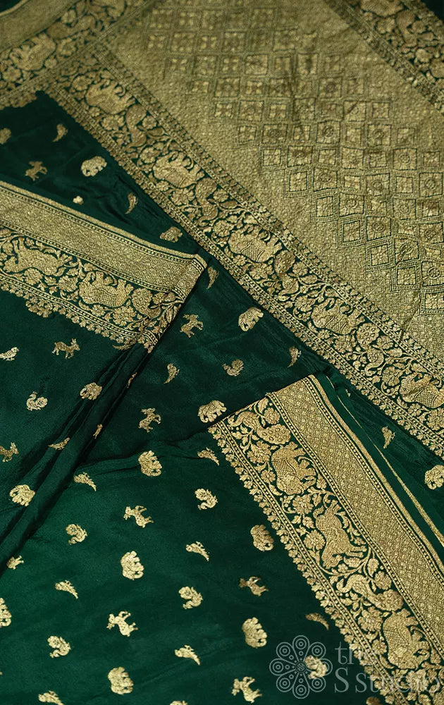 Green crepe banarasi silk saree with animal antique zari buttas
