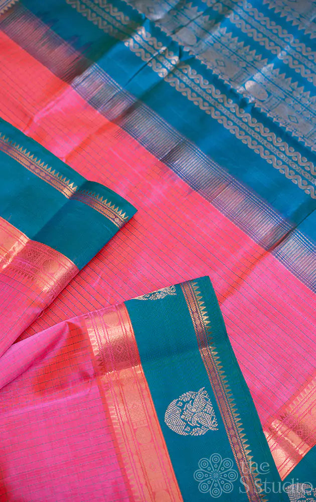 Pink checked silk cotton saree with teal blue border