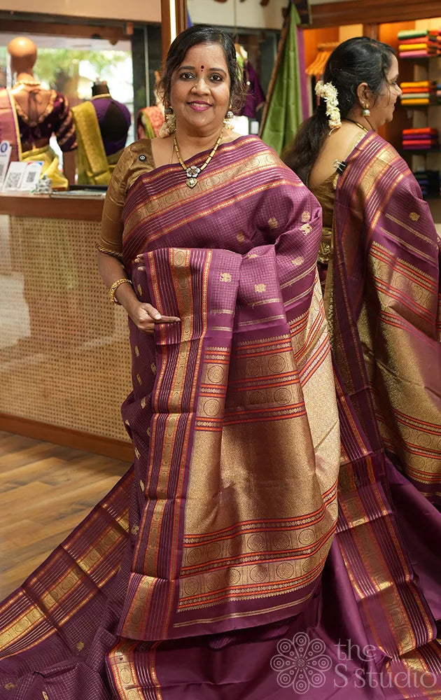 Brown zari checked kanchipuram silk saree with yazhi and peacock motifs