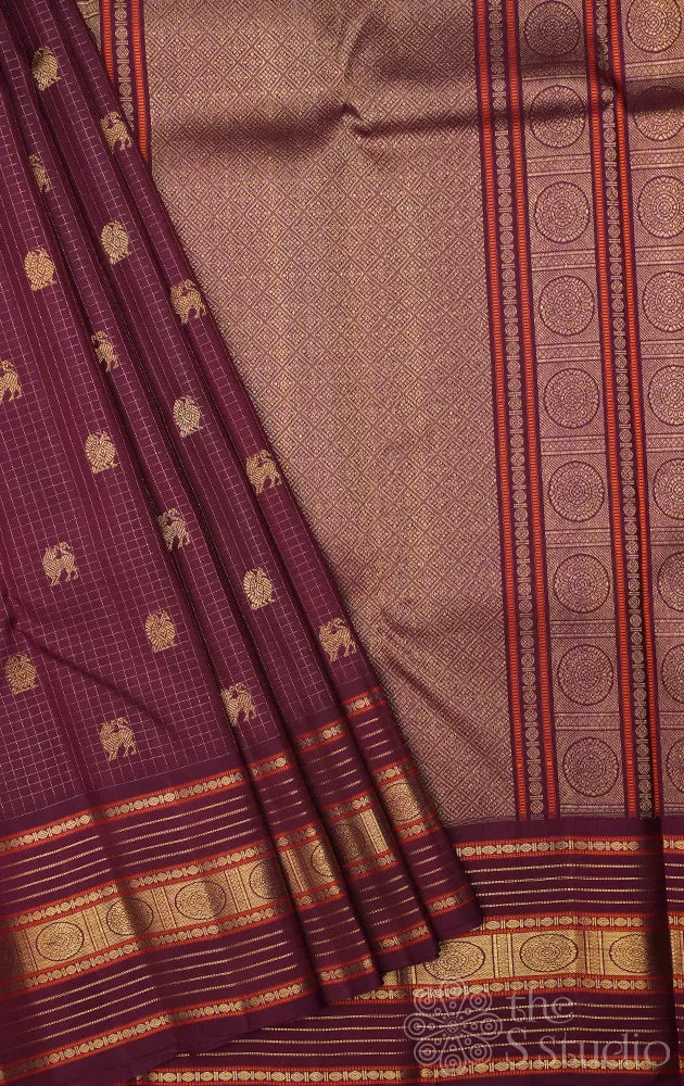 Brown zari checked kanchipuram silk saree with yazhi and peacock motifs