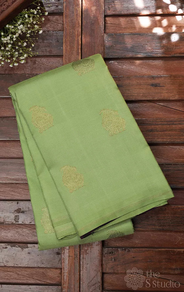 Elachi green kanchipuram silk saree with zari rich purple pallu