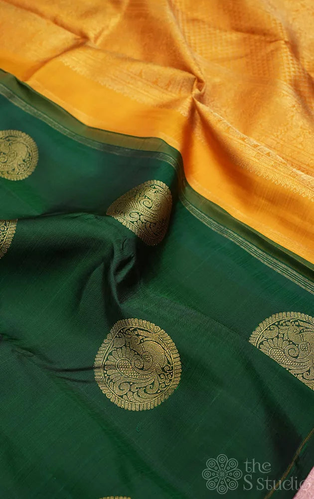 Bottle green kanjivaram silk saree with mustard pallu