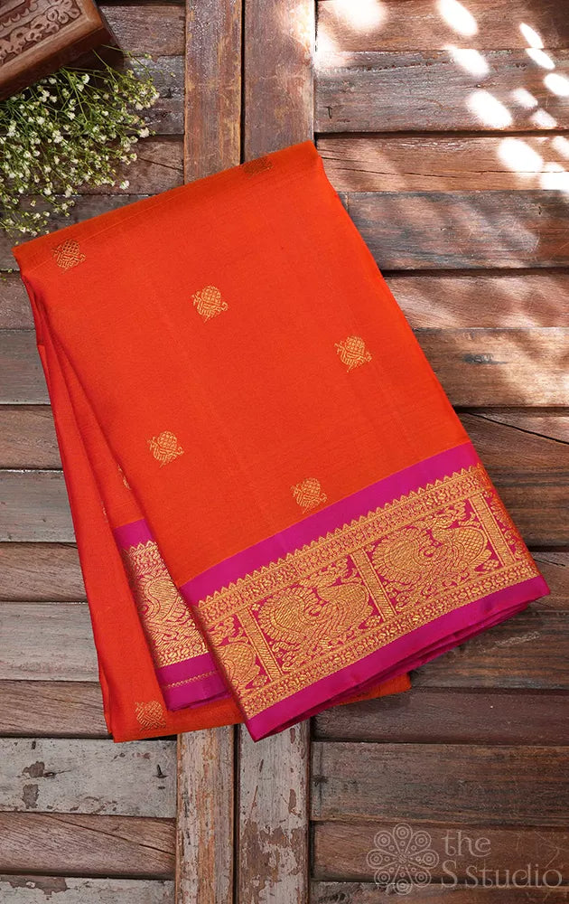 Orange kanjivaram silk saree with small rani pink border