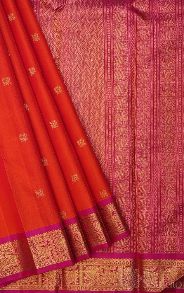Orange kanjivaram silk saree with small rani pink border
