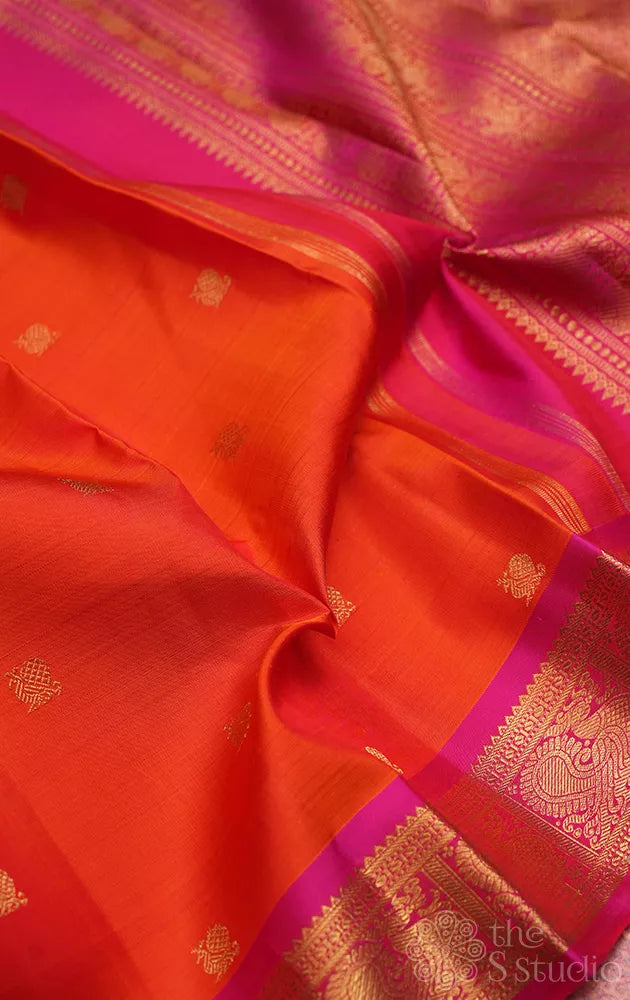 Orange kanjivaram silk saree with small rani pink border