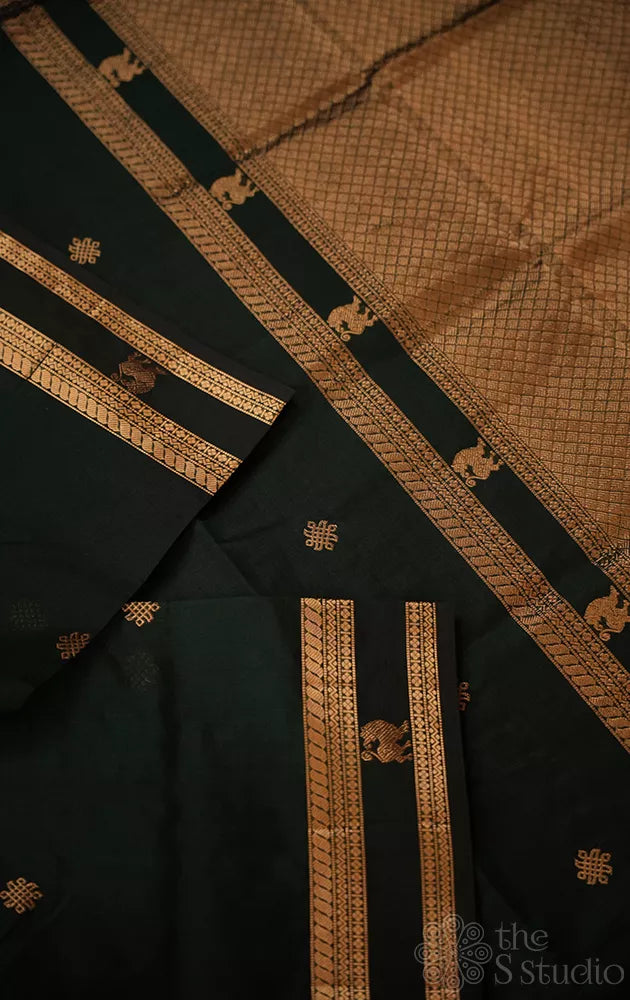 Bottle green silk cotton saree with rettai pet border