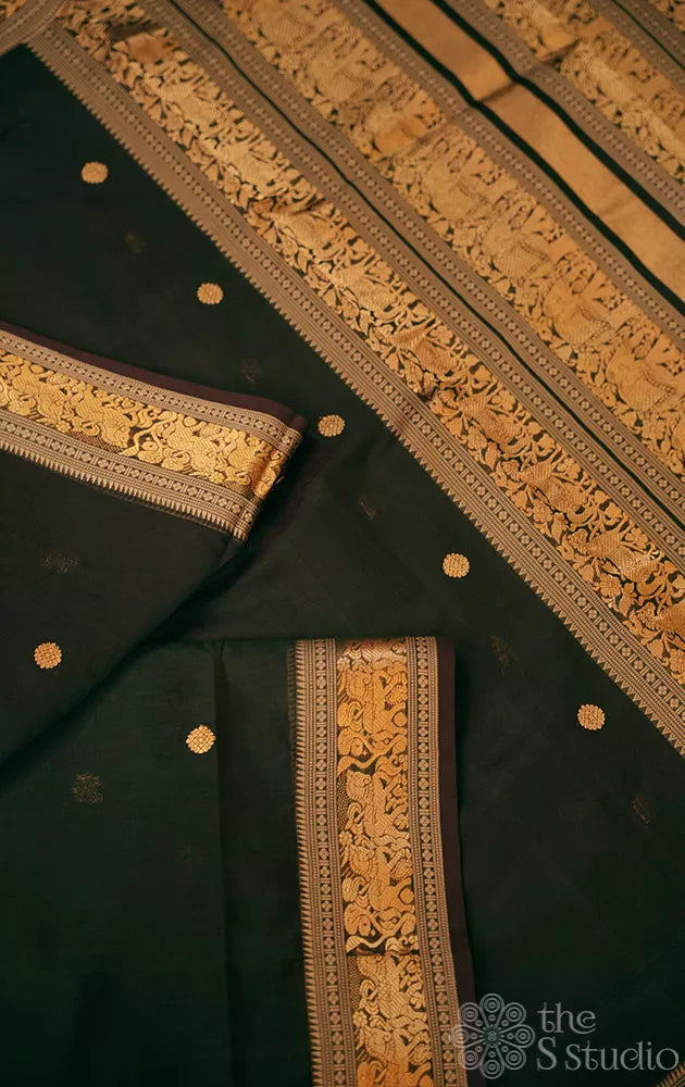 Dark green handloom silk cotton saree with small zari border