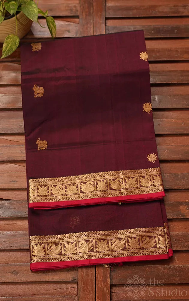 Maroon handwoven silk cotton saree with pichwai motifs