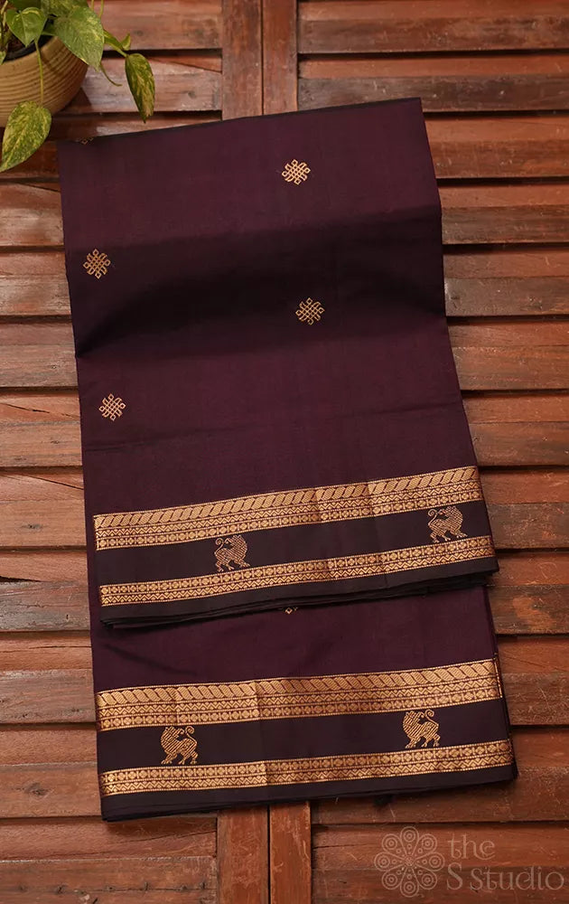 Dark purple silk cotton saree with zari border and yazhi motif