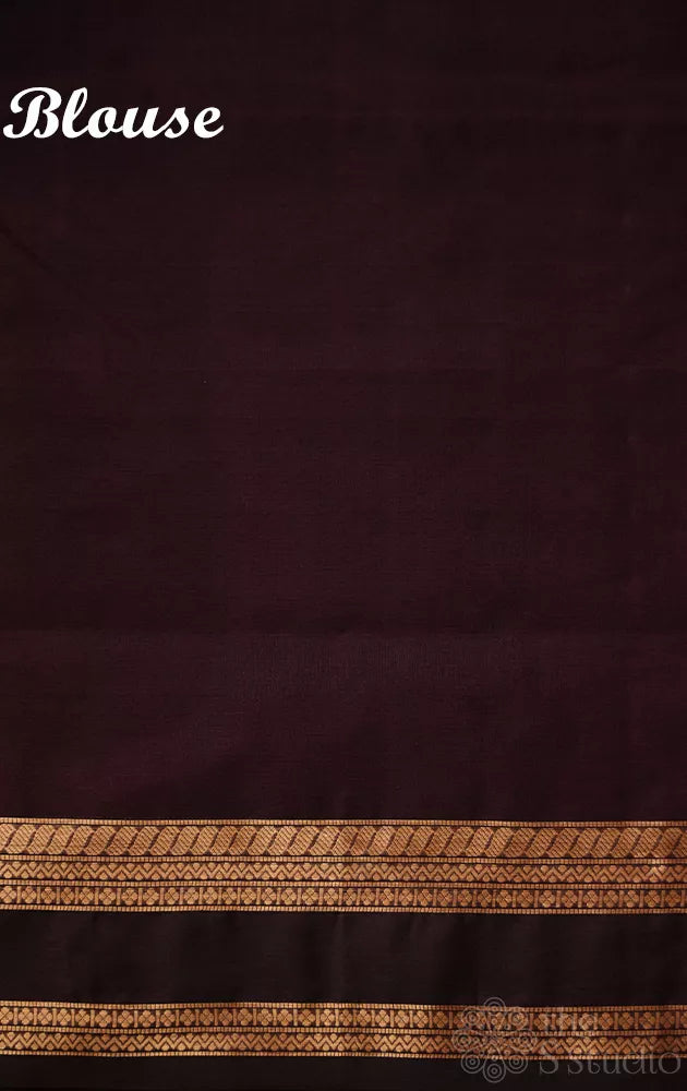 Dark purple silk cotton saree with zari border and yazhi motif