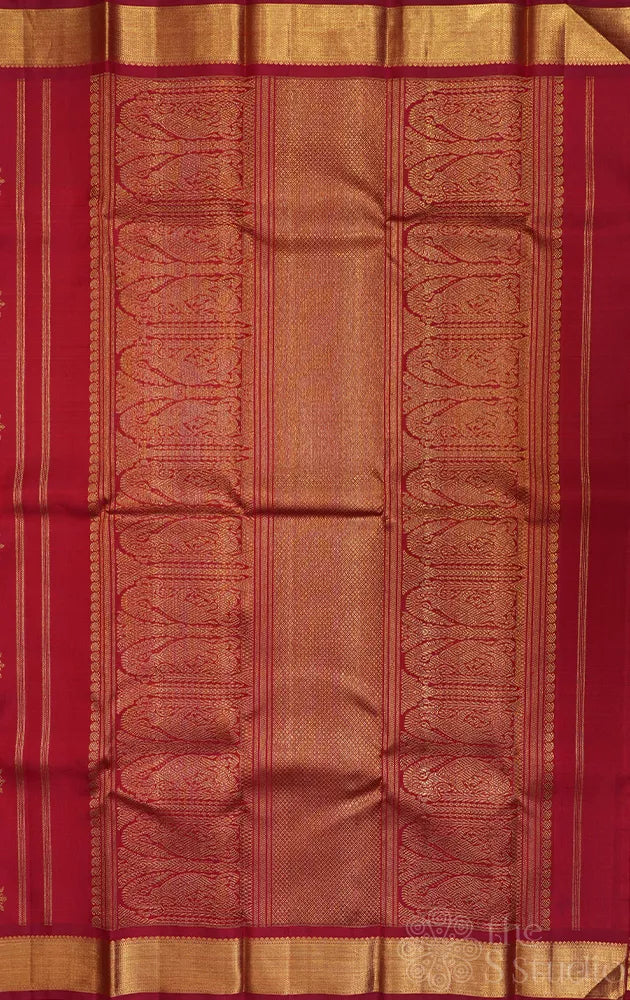 Maroon kanchipuram silk saree with all over buttas and getti border