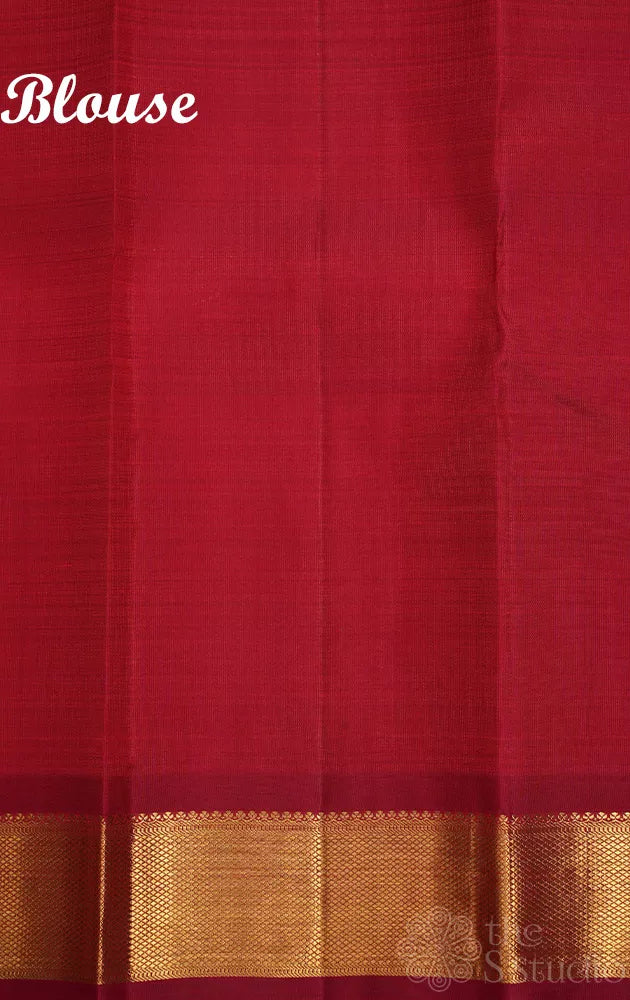 Maroon kanchipuram silk saree with all over buttas and getti border