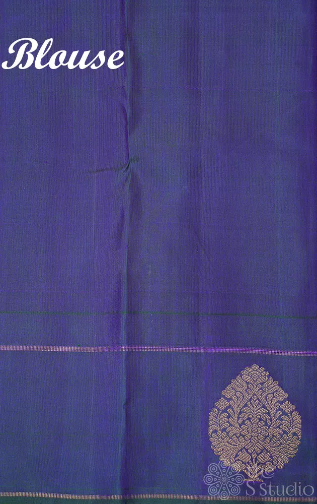 Peachish orange kanjivaram silk saree with a peacock blue border
