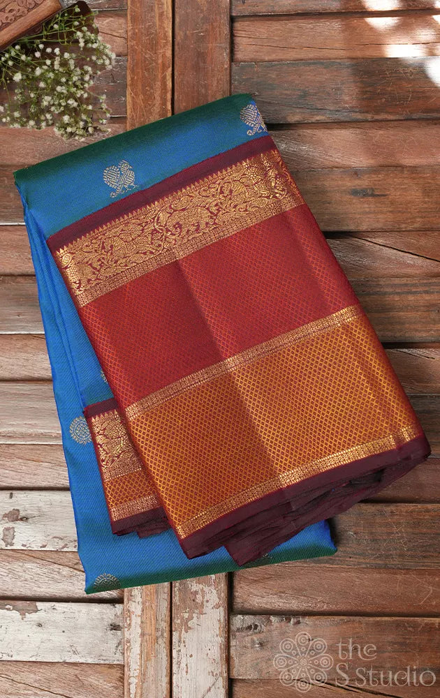 Peacock blue kanchipuram silk saree with maroon korvai border