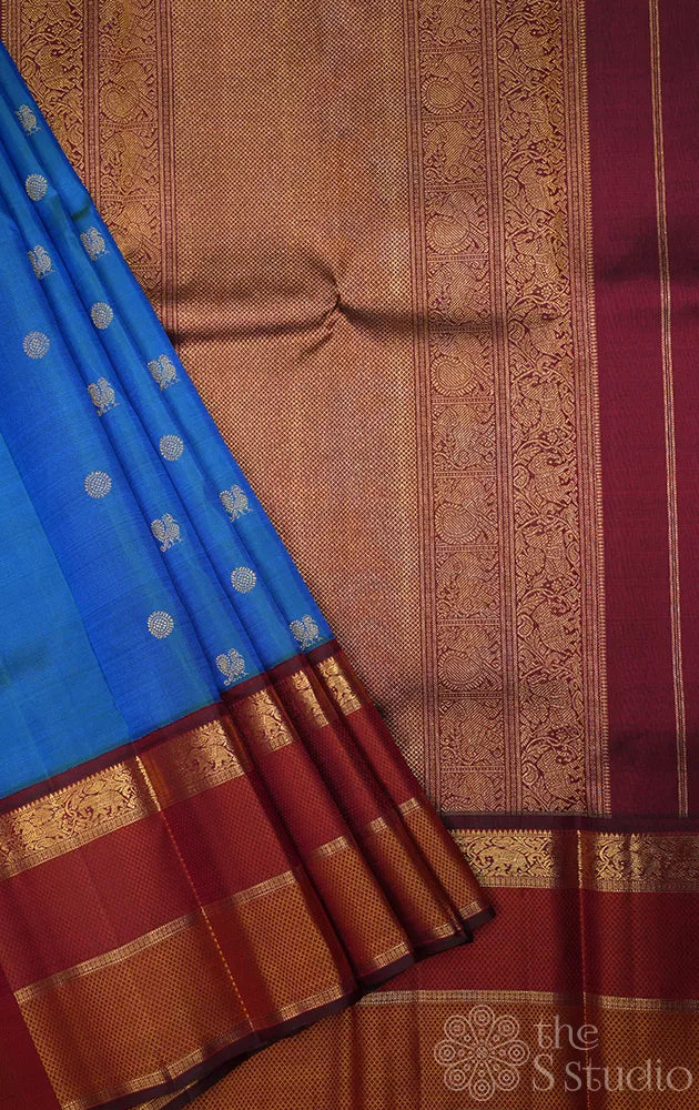 Peacock blue kanchipuram silk saree with maroon korvai border