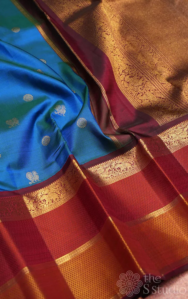 Peacock blue kanchipuram silk saree with maroon korvai border