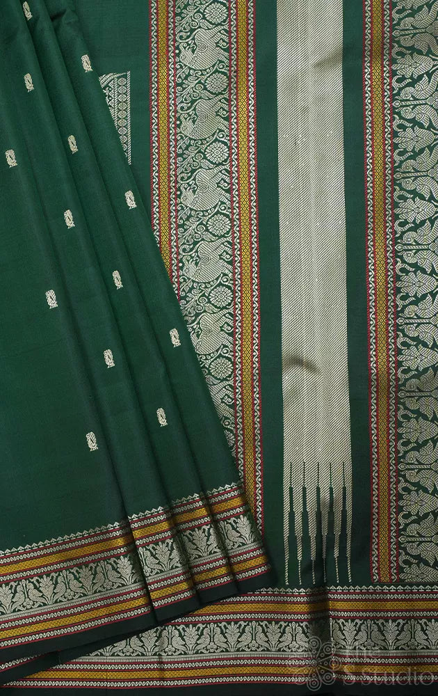 Bottle green kanchipuram silk saree with thread work border