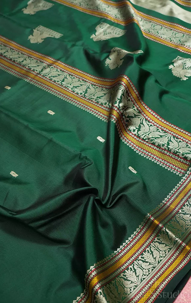 Bottle green kanchipuram silk saree with thread work border