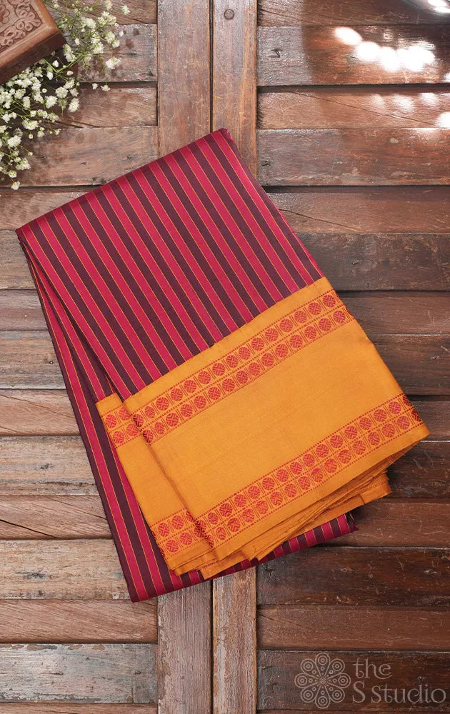 Maroon kanchi silk saree with threadwork kalakshethra design border
