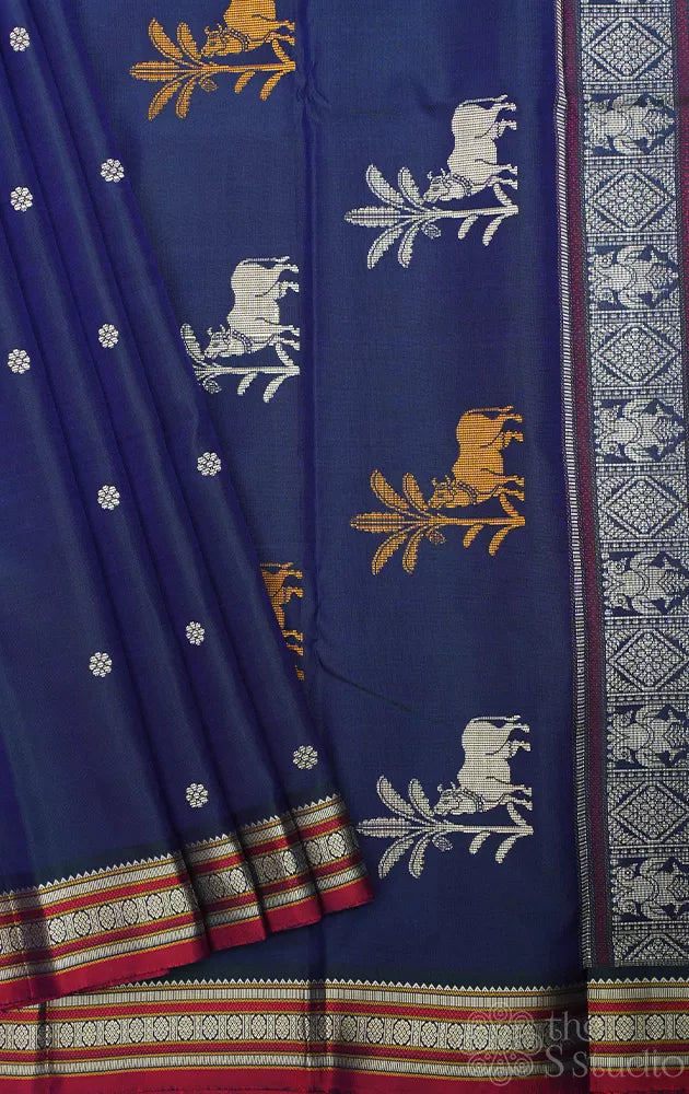 Peacock blue kanchipuram threadwork silk saree with pichwai cow woven motifs