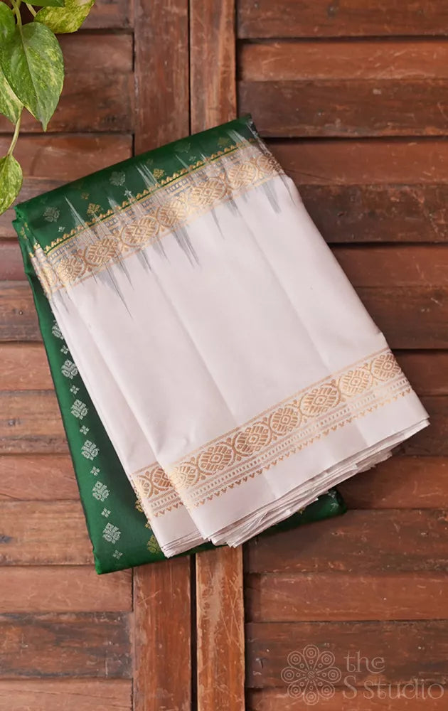 Green light weight silk saree with small zari buttas