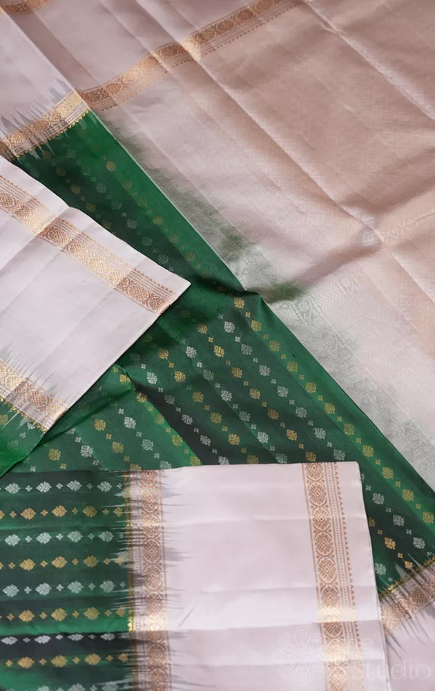 Green light weight silk saree with small zari buttas