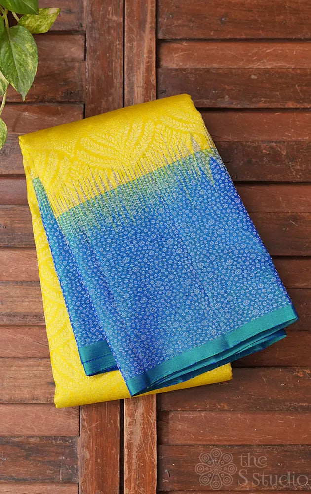 Neon green soft silk saree with peacock blue border