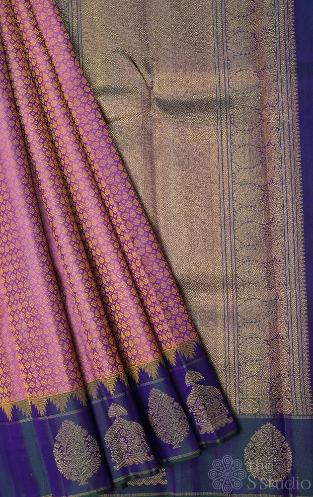 Mauve colour thread woven kanchi silk saree with peacock blue butta woven border