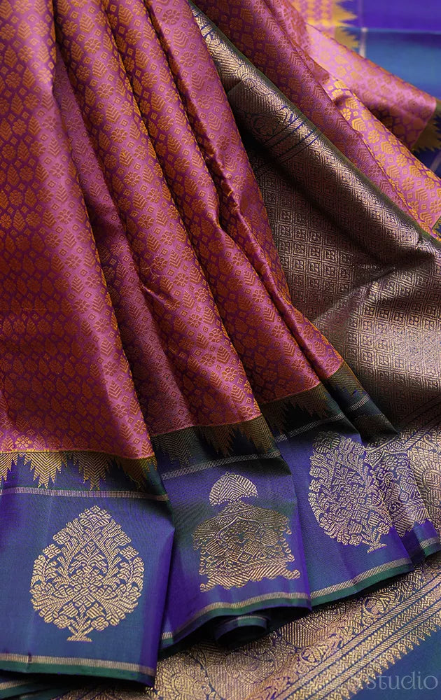 Mauve colour thread woven kanchi silk saree with peacock blue butta woven border