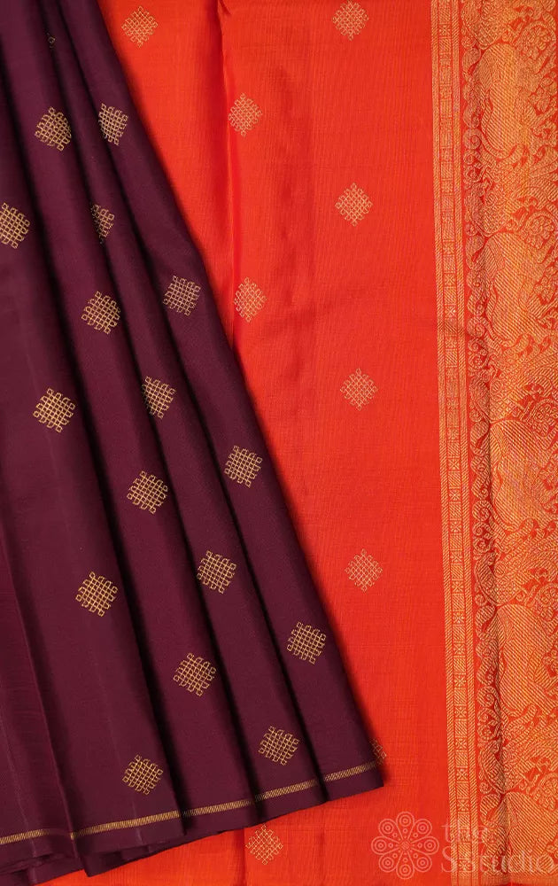 Brown kolam butta kanjivaram saree with orange pallu and blouse
