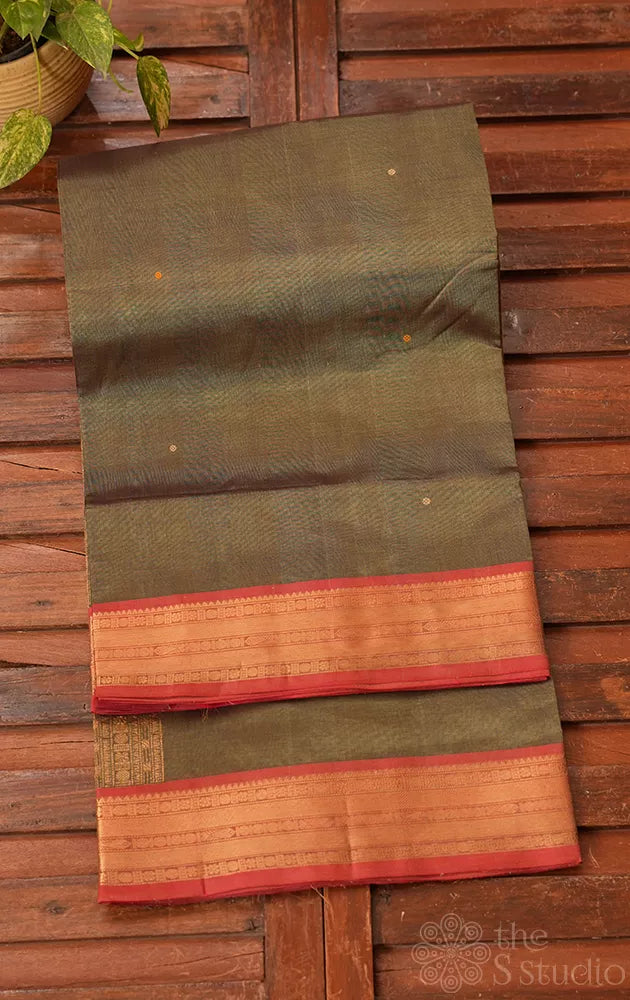 Sage green silk cotton saree with red small border with bomkai pallu