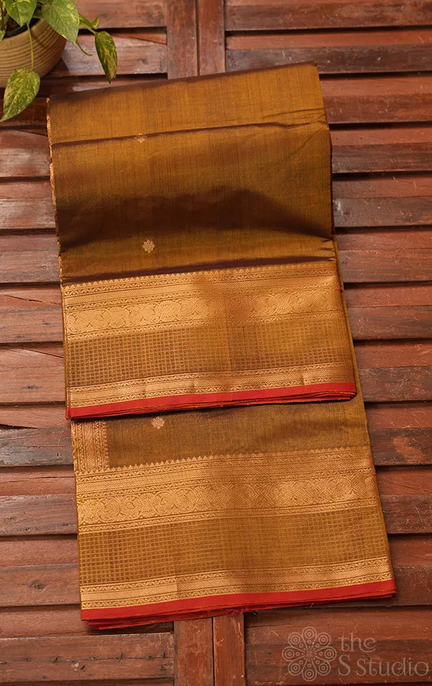 Golden green silk cotton saree with zari buttas