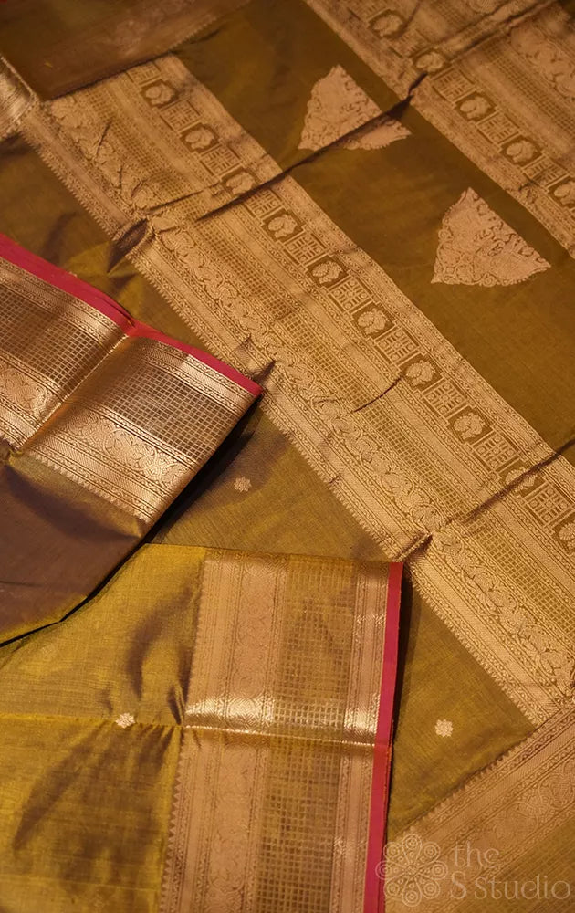 Golden green silk cotton saree with zari buttas