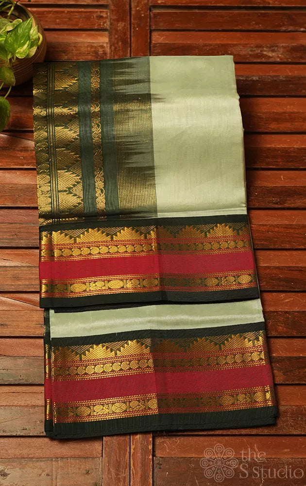 Elachi green plain silk cotton saree with korvai rettaipet border