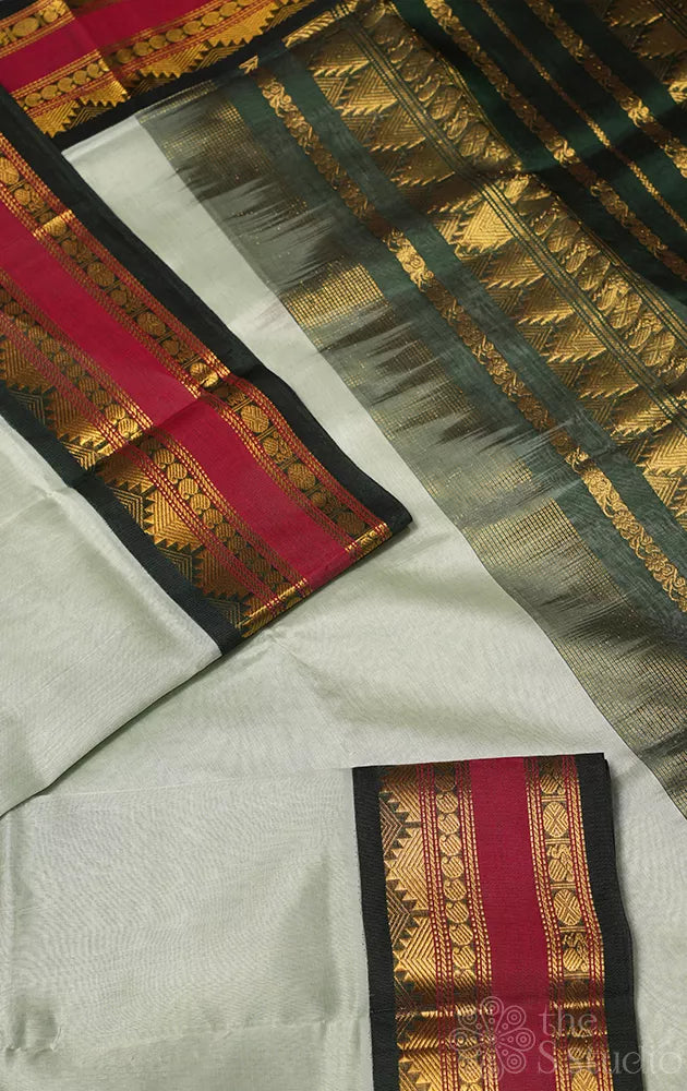 Elachi green plain silk cotton saree with korvai rettaipet border