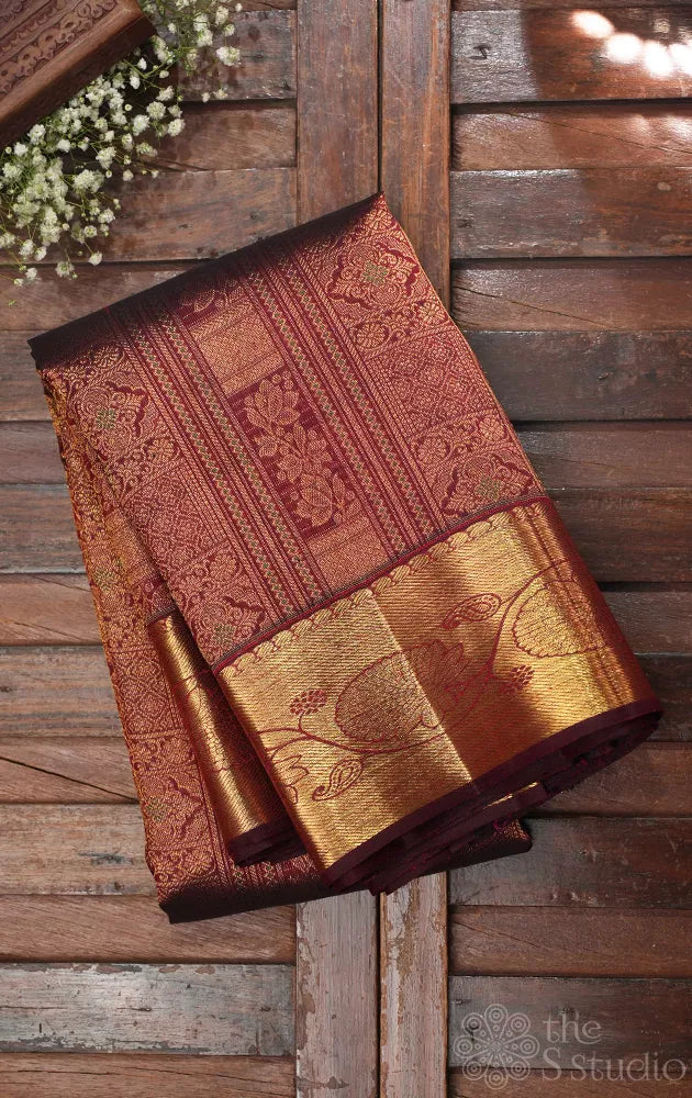 Dark arakku colour kanjivaram silk saree with floral zari border