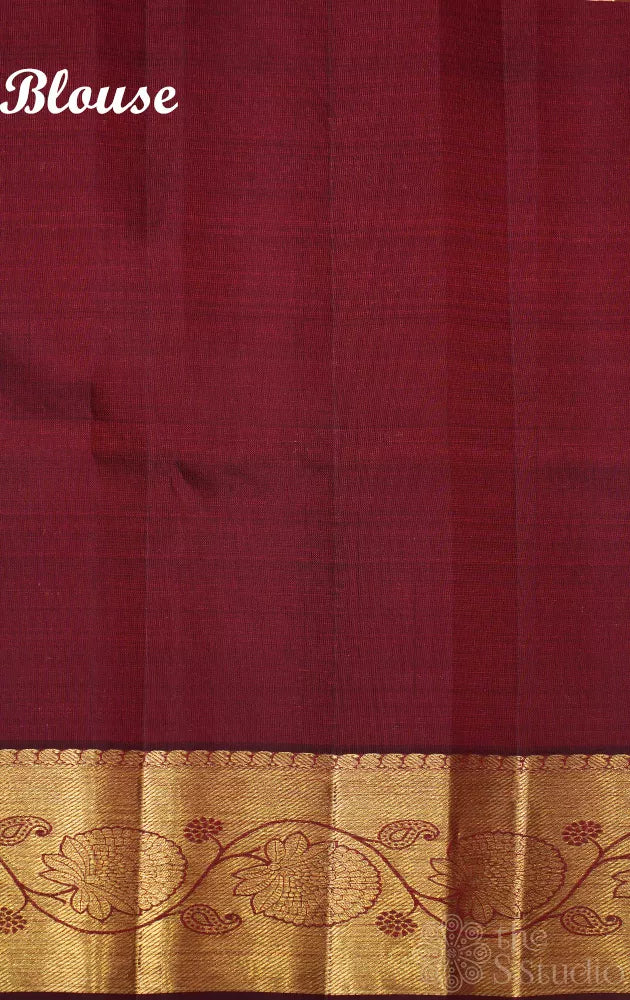 Dark arakku colour kanjivaram silk saree with floral zari border