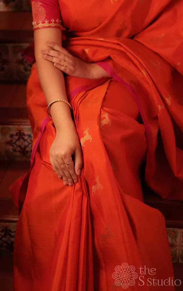 Orange deer butta kanjivaram silk saree with rani pink pallu