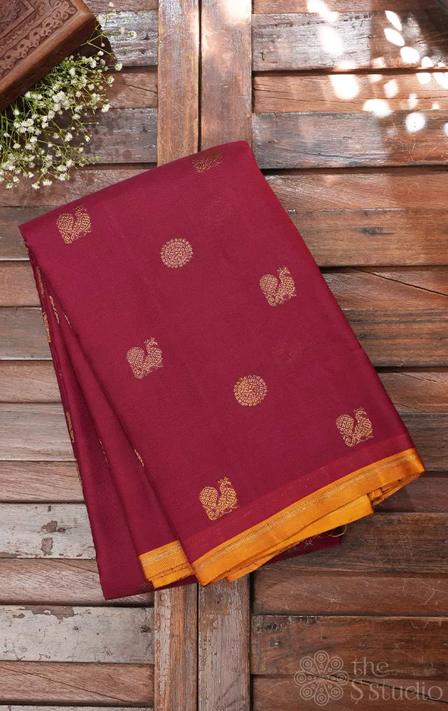 Maroon kora kanchi silk saree with mustard pallu
