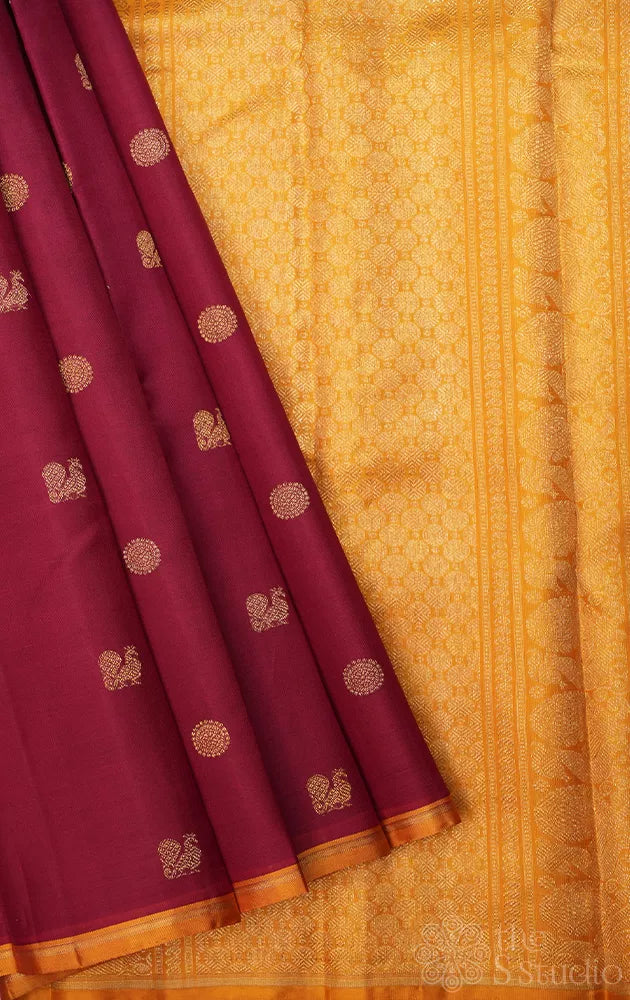 Maroon kora kanchi silk saree with mustard pallu