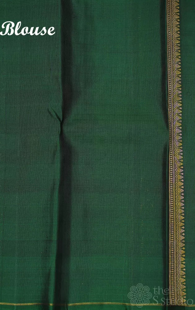 White and pastel green checked kanchi silk saree with bottle green long border