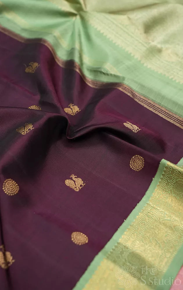 Dark brown korvai kanchipuram silk saree with small elachi green border
