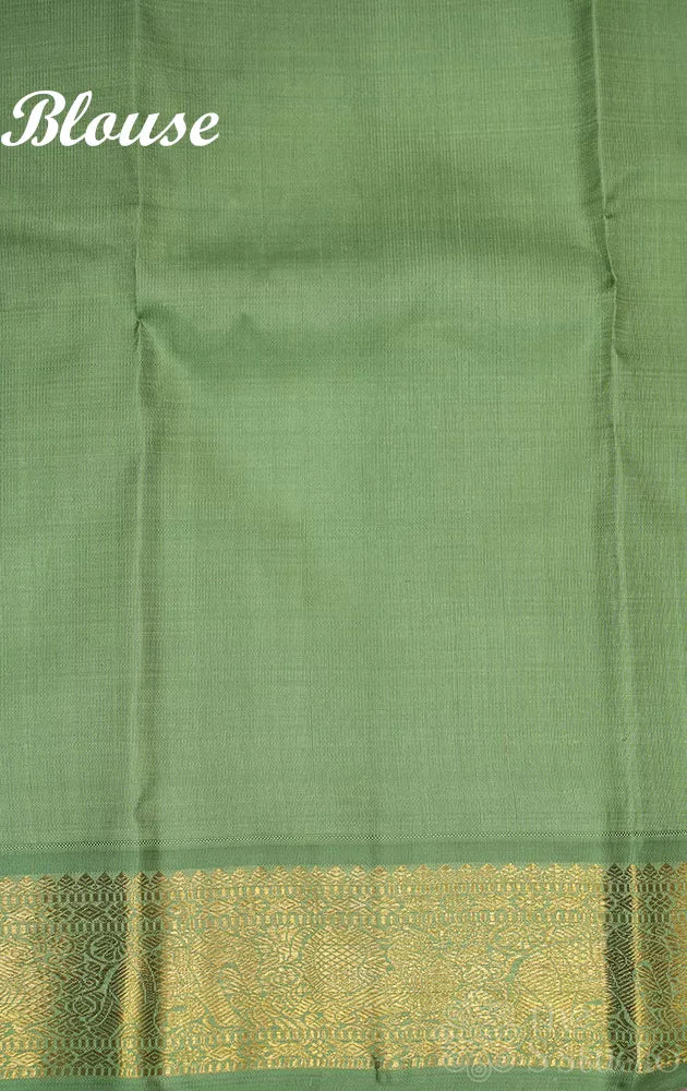 Dark brown korvai kanchipuram silk saree with small elachi green border